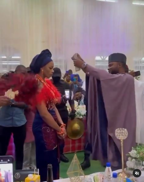 Unhappy Bride Remains Unmoved Despite the amount of Cash Raining on Her (Video)